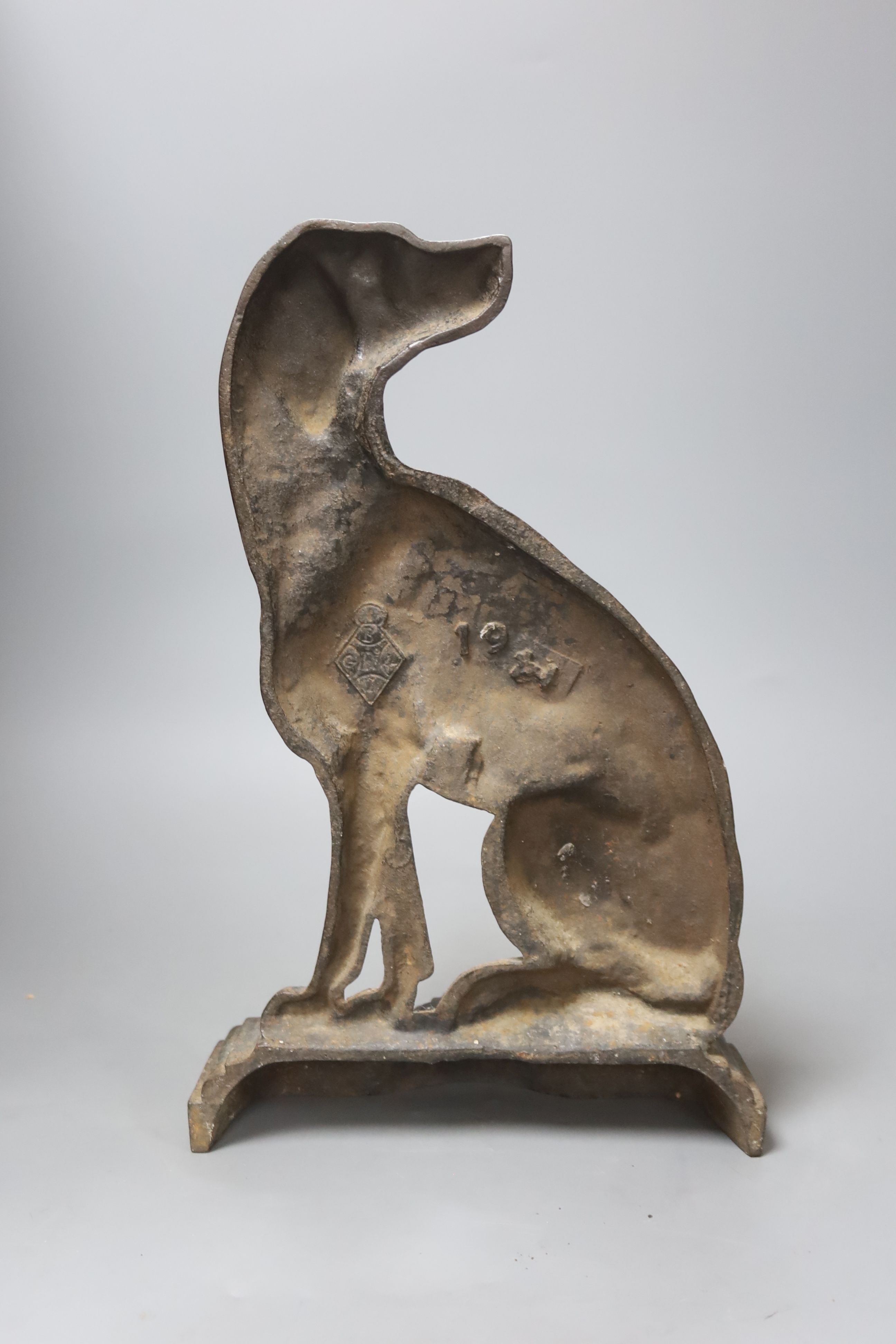 A Victorian Coalbrookdale style cast iron seated spaniel doorstop, registration mark, length 37cm